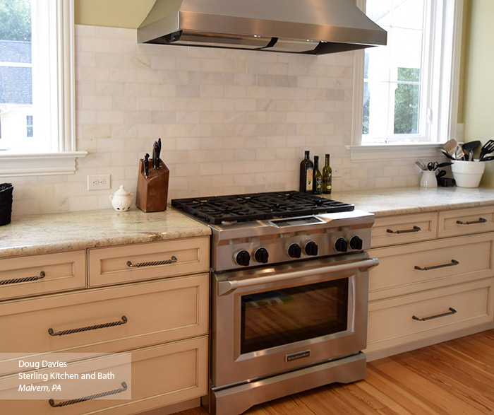 Off white glazed cabinets in a casual kitchen